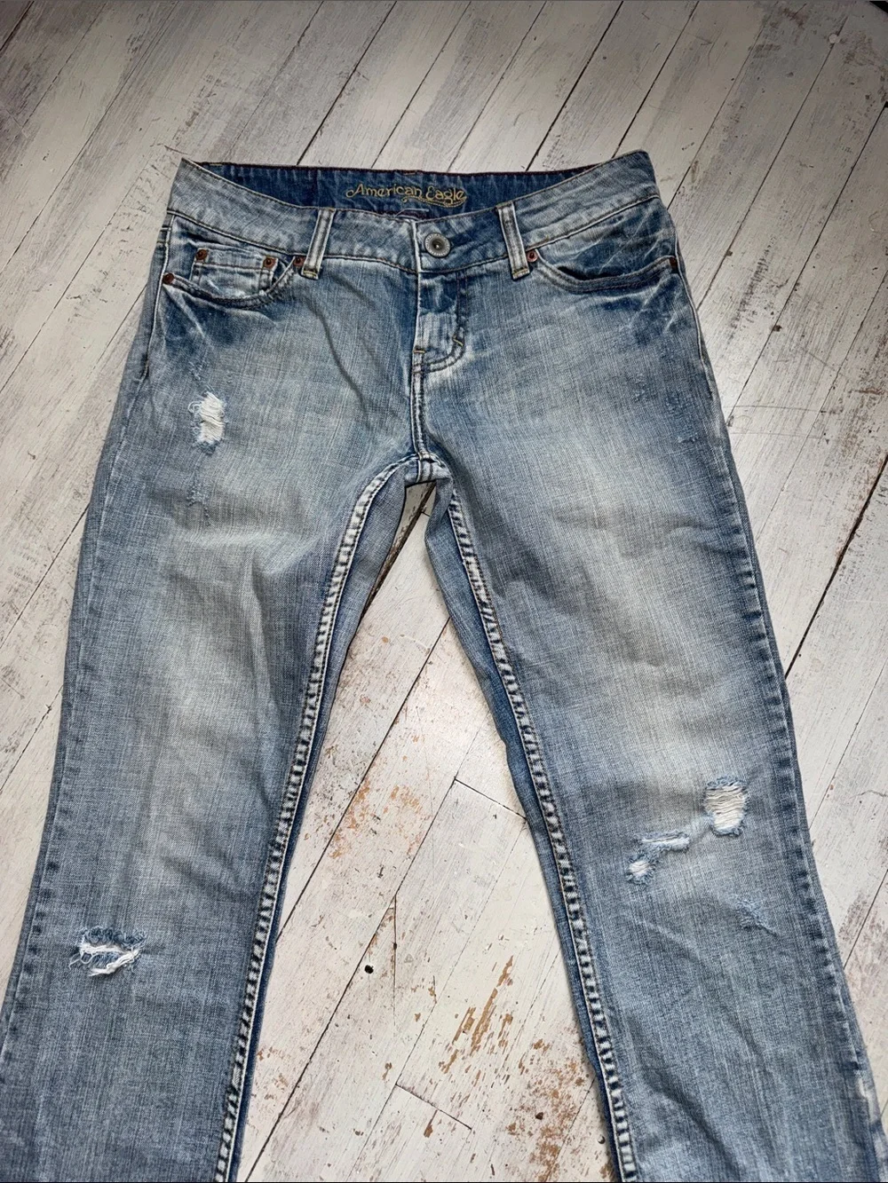 American Eagle Outfitters faded blue distressed jeans